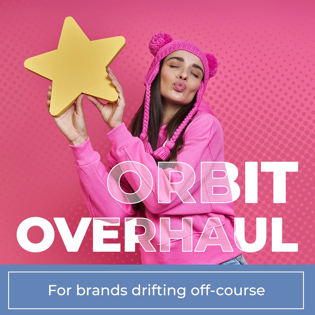 A woman with a tracksuit top on holding a cut out star