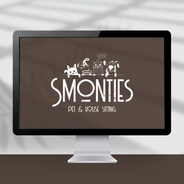 Computer screen showing a logo design with cartoon hand drawn dogs