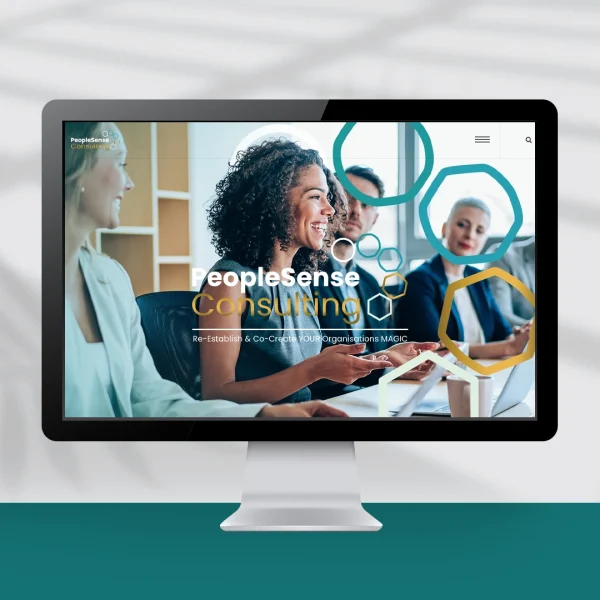 Computer screen showing a website design showing a corporate team around a table