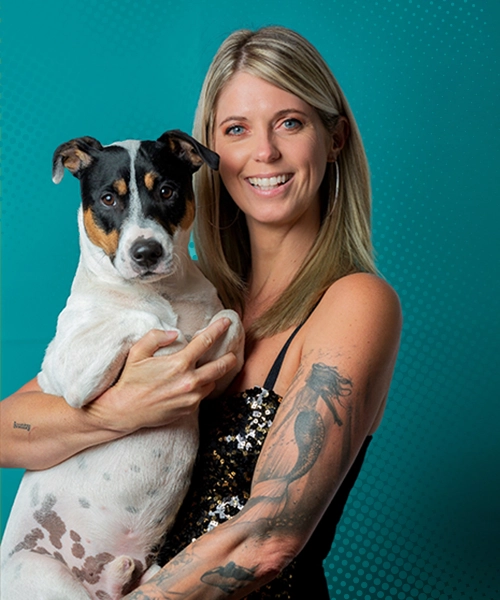 Image of a woman holding her little dog